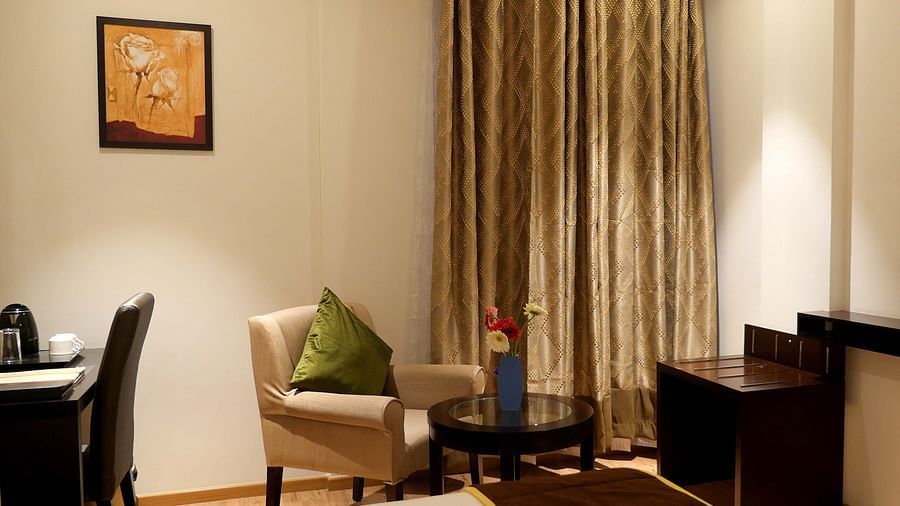 view of TV and seating area of Premium Double Room of ASR Parklane, Hosur