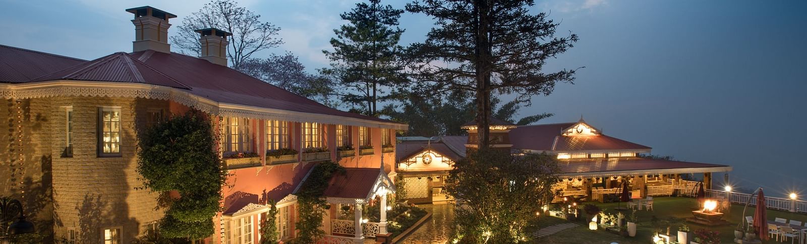 the outside lawn during nighttime - Mayfair Himalayan Spa Resort Kalimpong