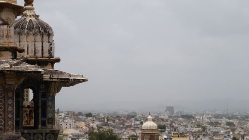 View of the Alwar city as seen from the ramparts of City Palace, showing urban landscape in the background.