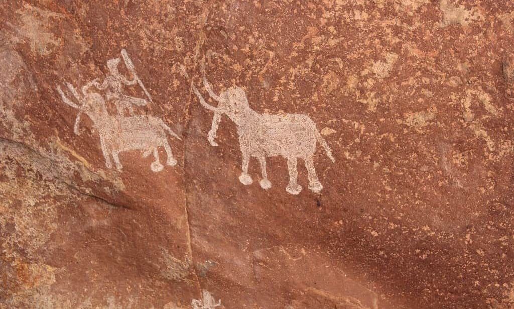 Prehistoric rock painting of elephants from Bhimbetka.
