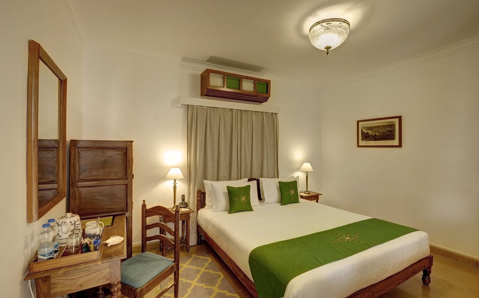 Residency Room with a double bed and work desk and chair at Saraca Hotel, Lucknow