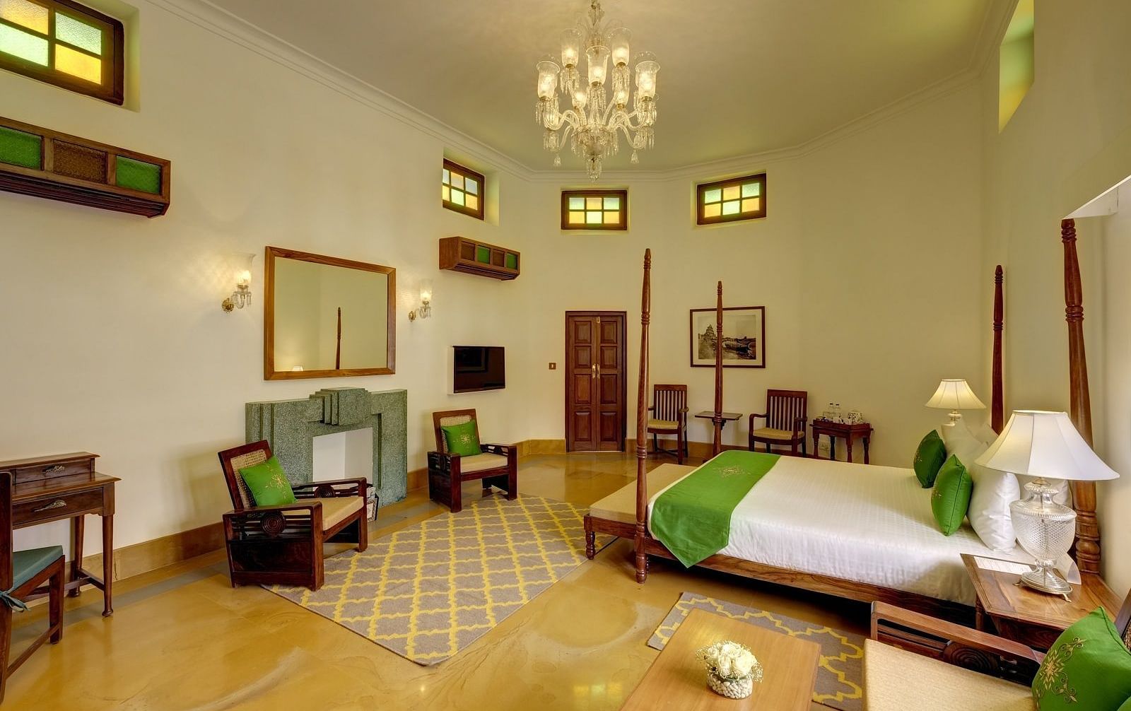 Heritage Suite at Saraca Hotel, Lucknow with a double bed and a chandelier