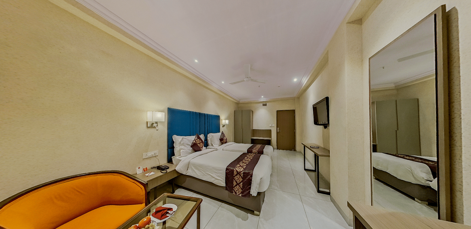 Premium twin bed accommodation at Lords Eco Inn Dahej featuring matching beds, stylish furnishing, and comprehensive guest amenities