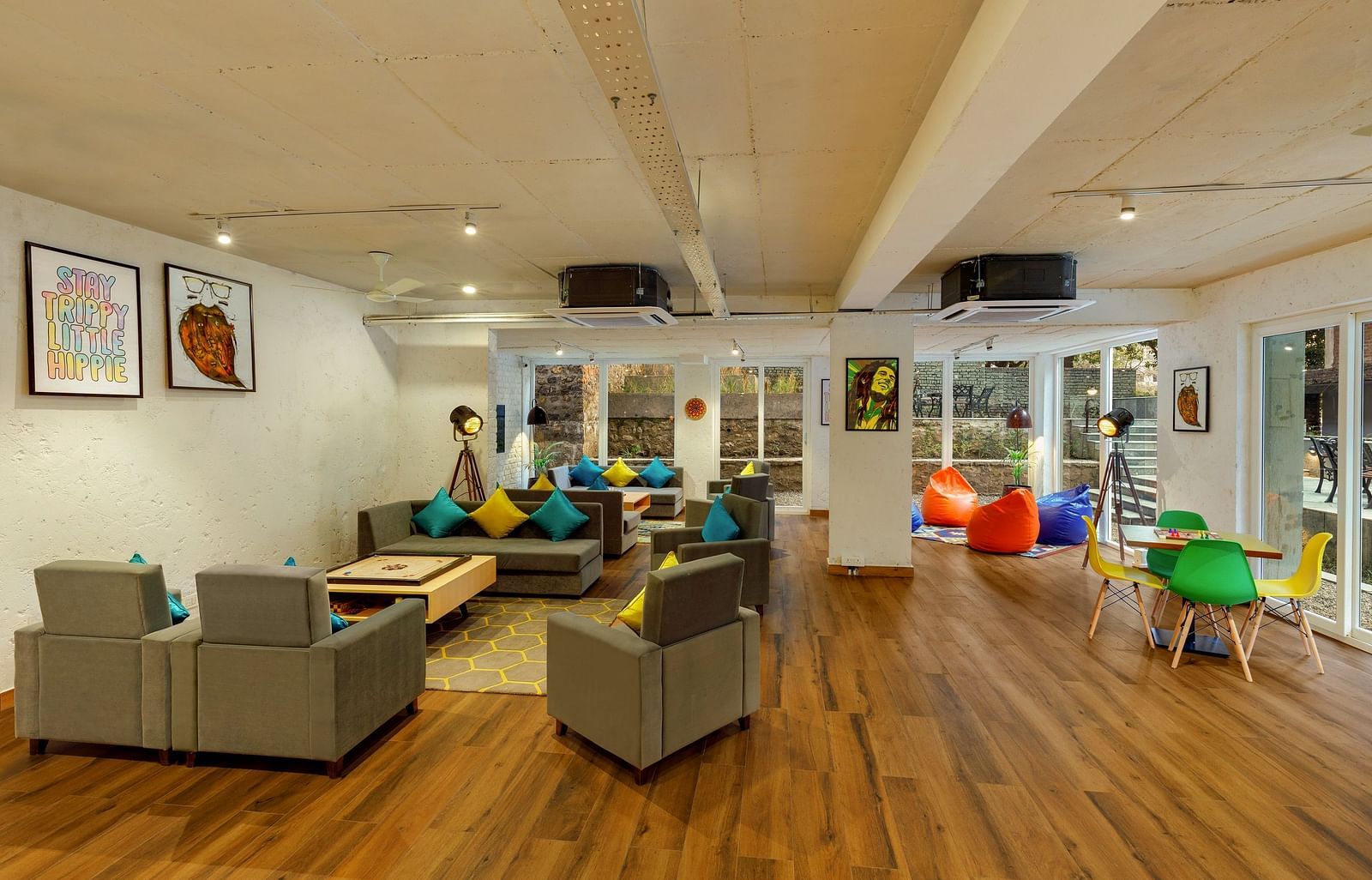 Cosy seating area with carom board and chessboard for leisure and games at Bedzzz, Rishikesh