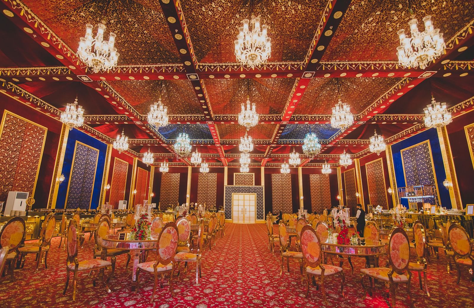 An overview of a banquet hall with round table seating arrangement - Rajasthali Resort & Spa, Jaipur.