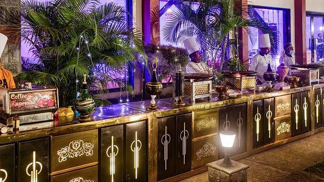 alt-text Festive bar area with colorful lights and decorations.