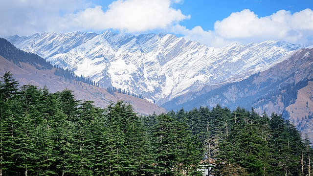 A scenic view of snow covered mountains