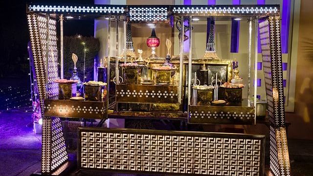 alt-text Festive bar area with colorful lights and decorations.