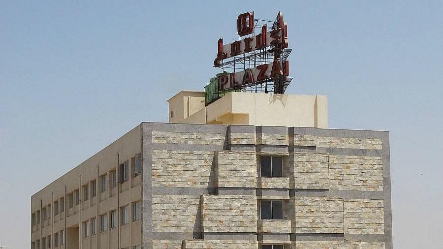 The exterior view of Lords Plaza Ankleshwar with a stone facade, multiple floors, and a sign displaying the hotel's name