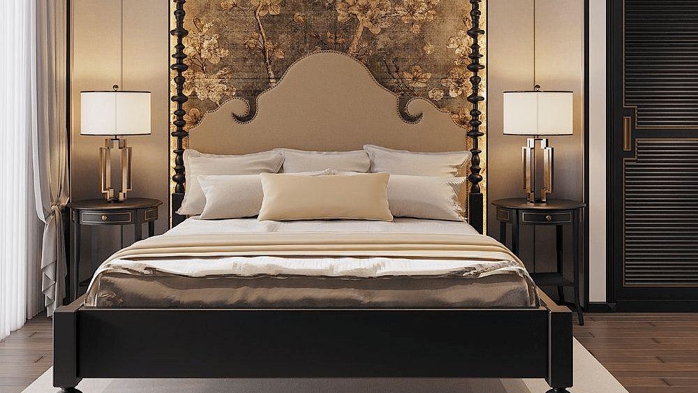 Front view of a well-made bed with cushions, a ceiling fan, and two bedside tables with lamps at The Evren, Vagator.