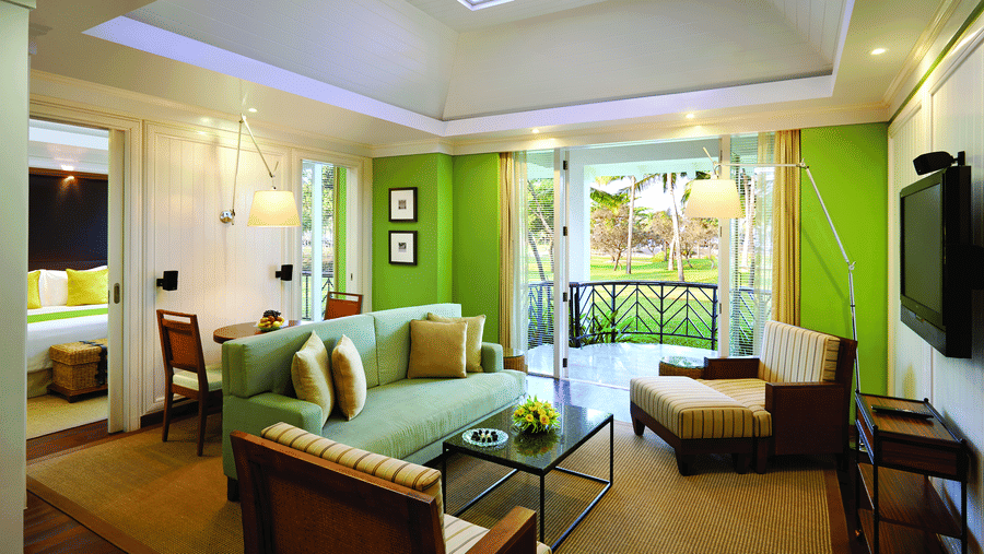 overview of the living room with sofas and table inside Presidential Villa - Caravela Beach Resort Goa