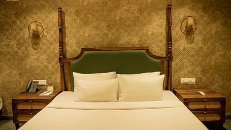 An image of the Tamara room with a king size bed, bed side tables, with decorative lighting, and minimal decoration - Trance Veecika Resort