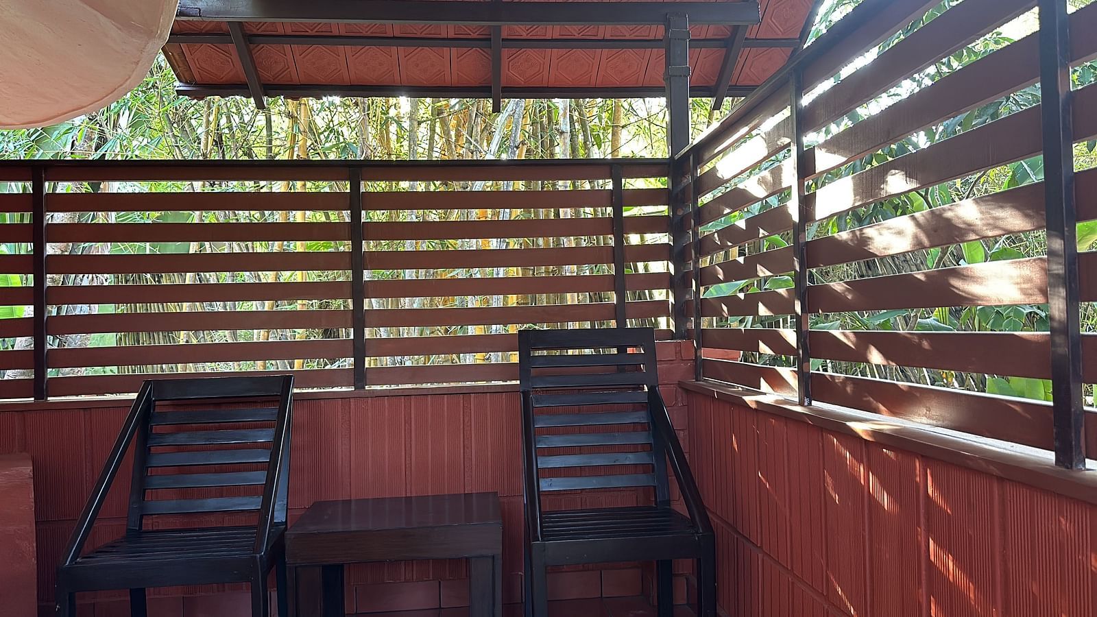 view of a verandah with chairs kept in shade - Kadkani River Resort, Coorg