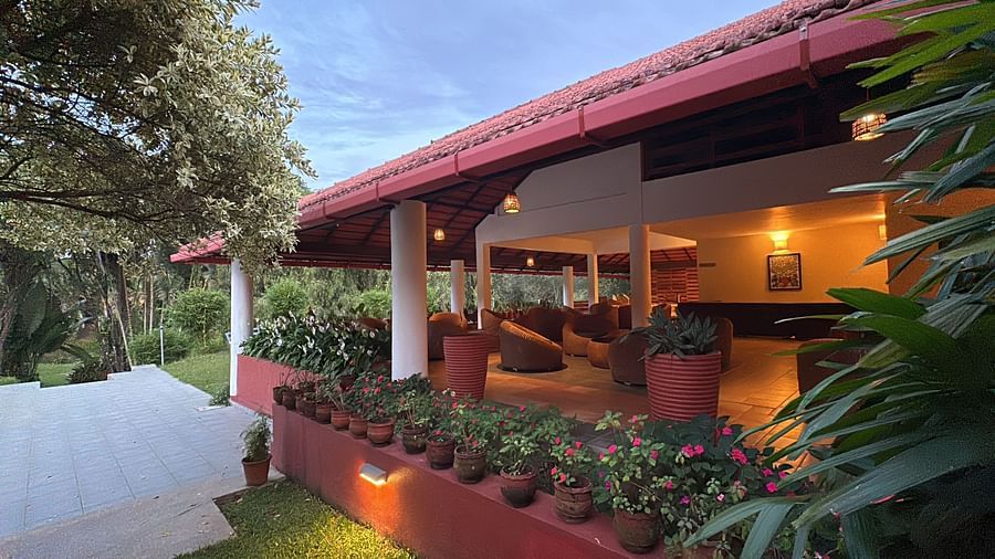 view of the hotel with a lake beside the common area - Kadkani River Resort, Coorg
