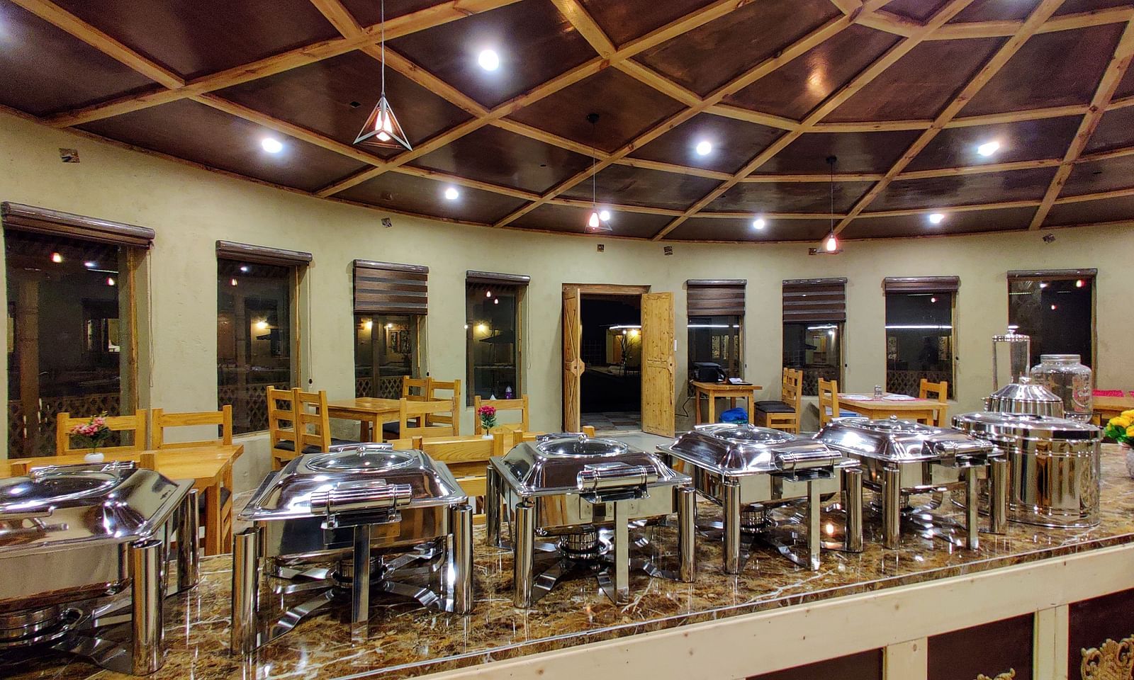 A closer view of the buffet setup at dining area at White Sands Resort, Ladakh showcasing the variety of food and serving dishes available.