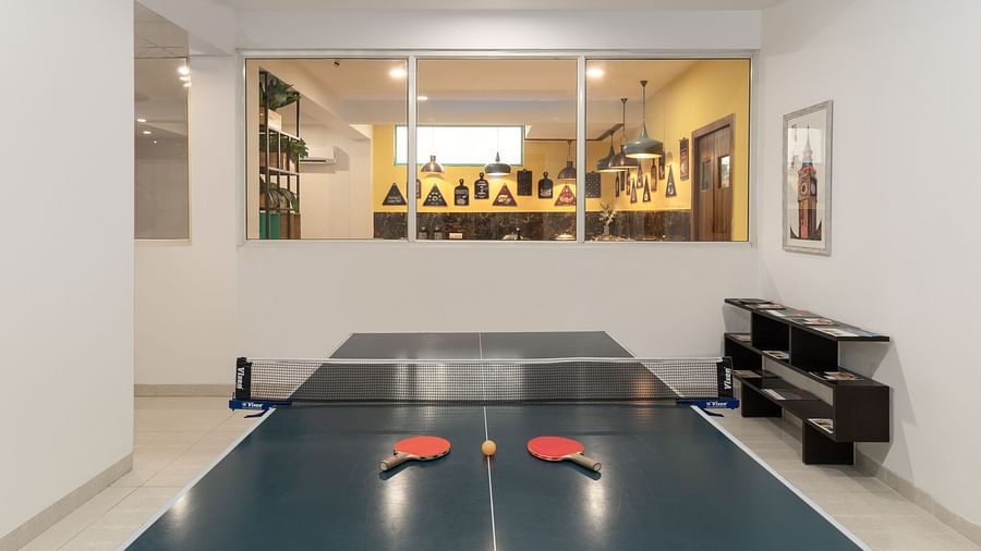 Table Tennis Court at Inde Hotel Cyber City  with tennis bats and a ball