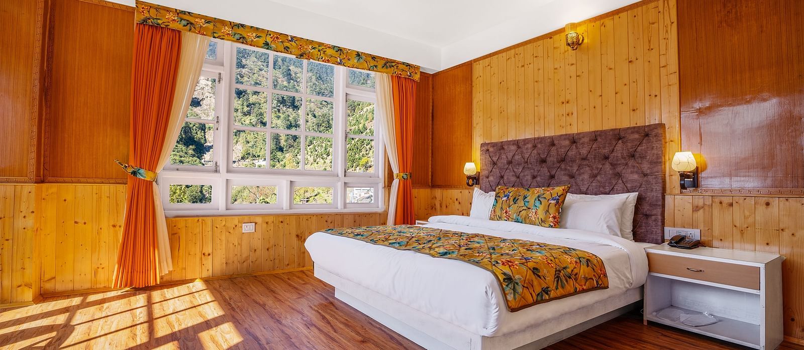 Image of a room with bed and the rays of sun coming through the window at Summit Gangchen Hotel, Lachen