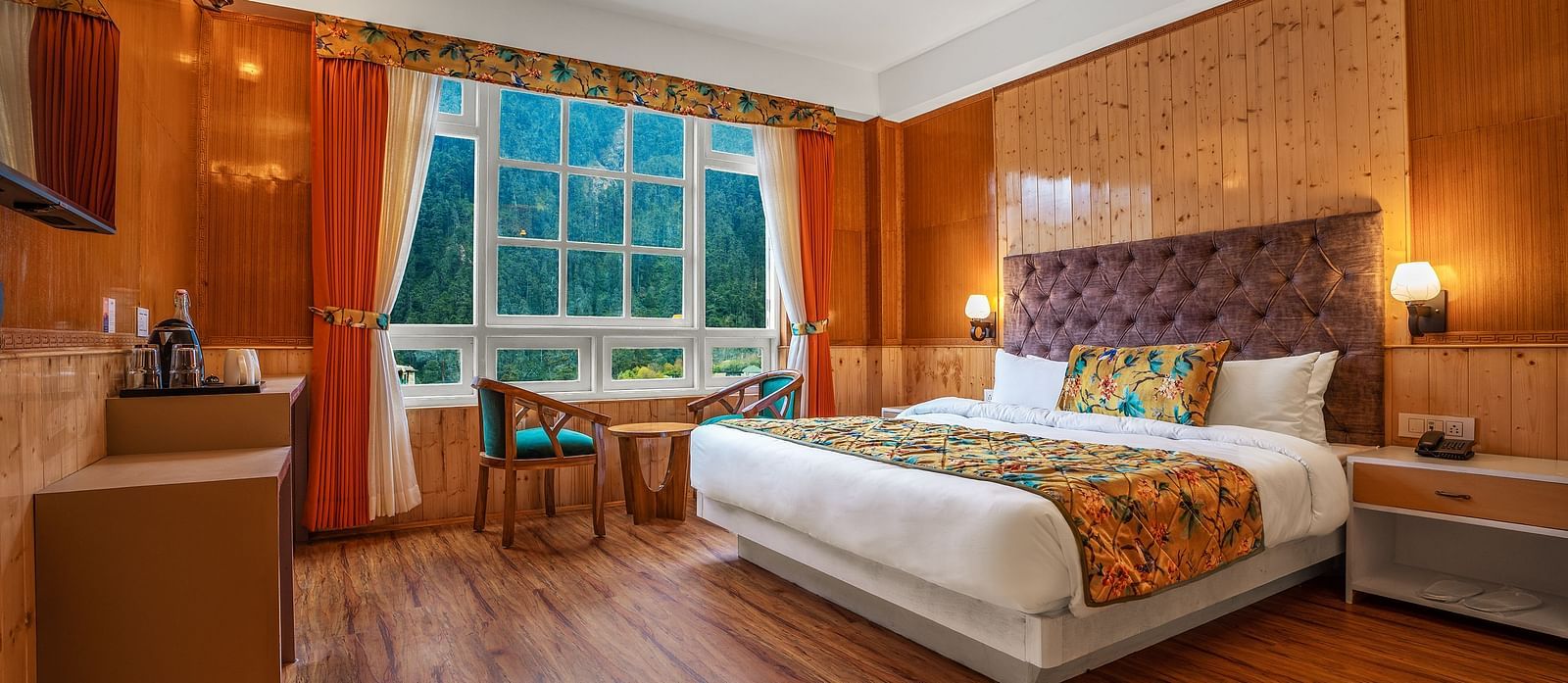 Image of a room with bed and television at Summit Gangchen Hotel, Lachen