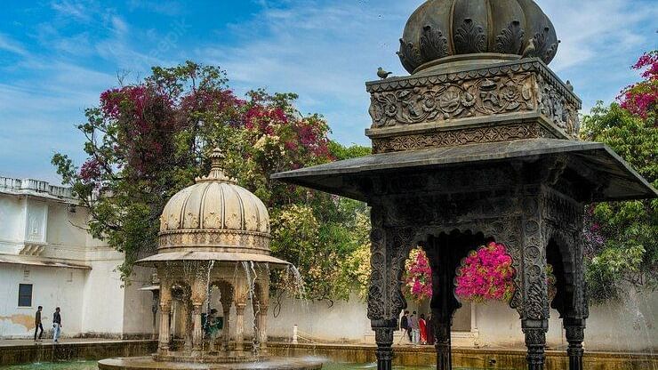 Sahelion ki bari garden fountain with blue skies in the background - Chunda Hotels