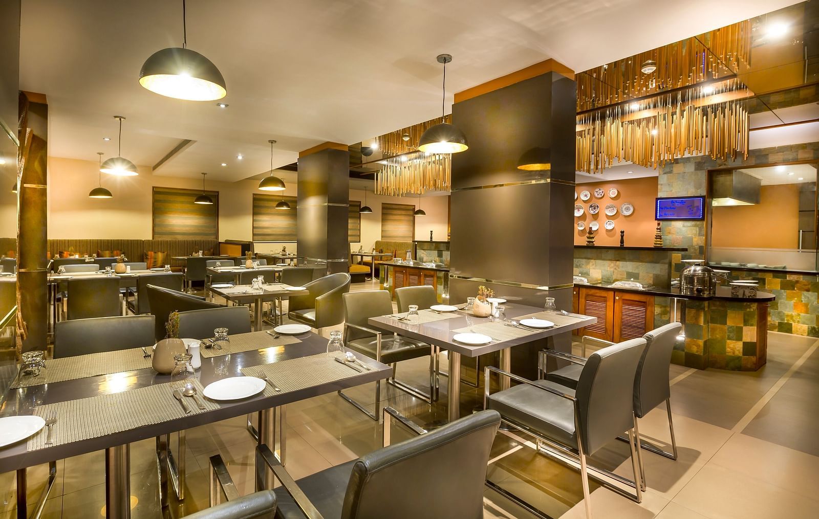  Modern restaurant interior with dark wood accents, leather chairs, and ambient lighting.