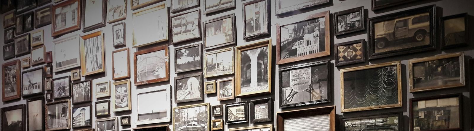 A wall entirely displayed with lot of photos each telling a story.