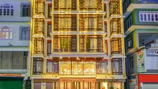 The facade view of hotel illuminated by its night lights at Sumitel Oriental, Gangtok.