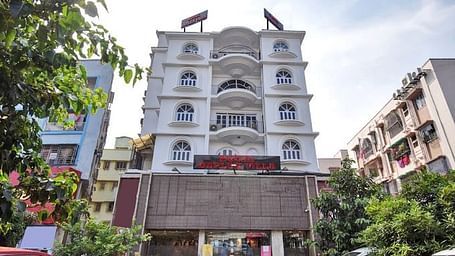 Facade view of Ecotel Kolkata with other building next to it