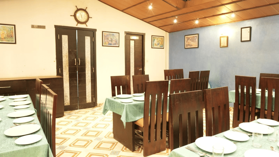 Sets of Chairs and table inside a restaurant in an ordered fashion