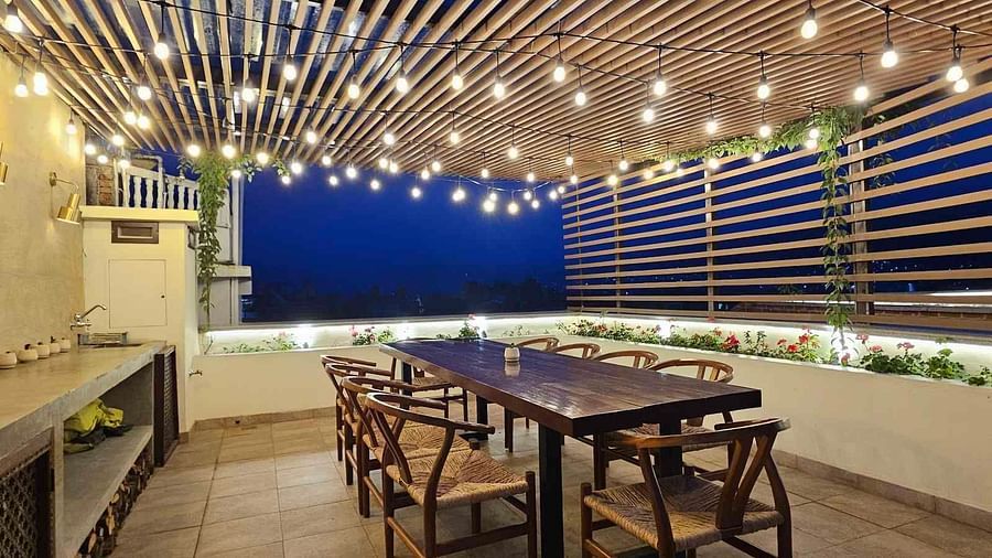 The Nanee Chefs Table with seating arrangement and decorative lighting