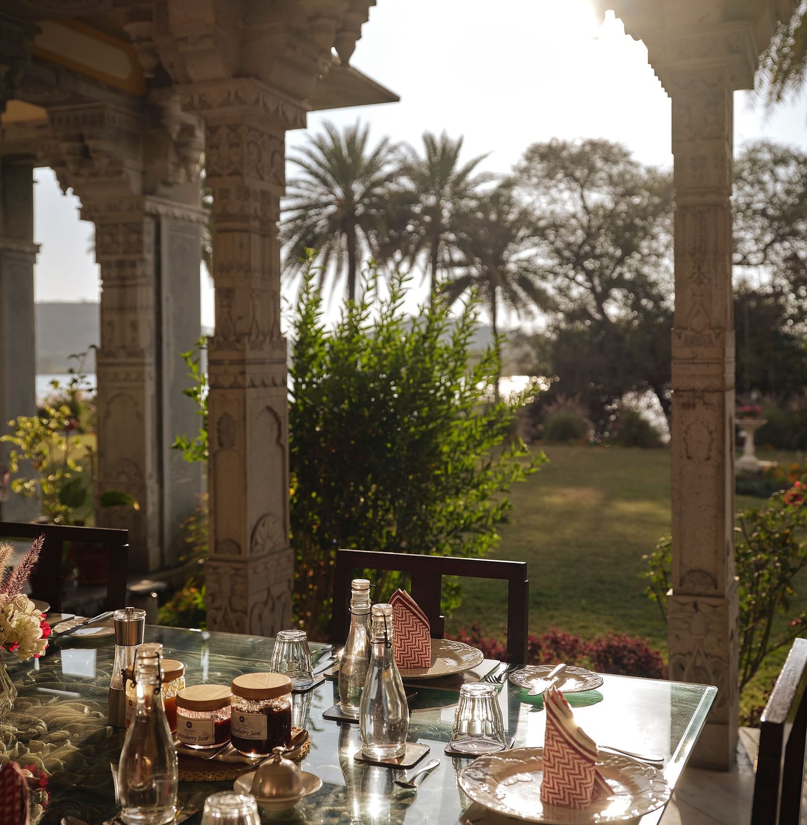 image of the dining area overlooking at the lush green lawn at dev shree, deogarh