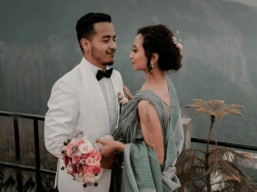 Polo Resort Cherrapunji wedding poster showing groom in white tuxedo and bride in pastel sari holding bouquet, with logo and Live your dream wedding text.