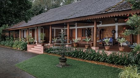 A facade of BluSalzz Villas - Muhamma Resort, Alleppey featuring the villas and greenery around it