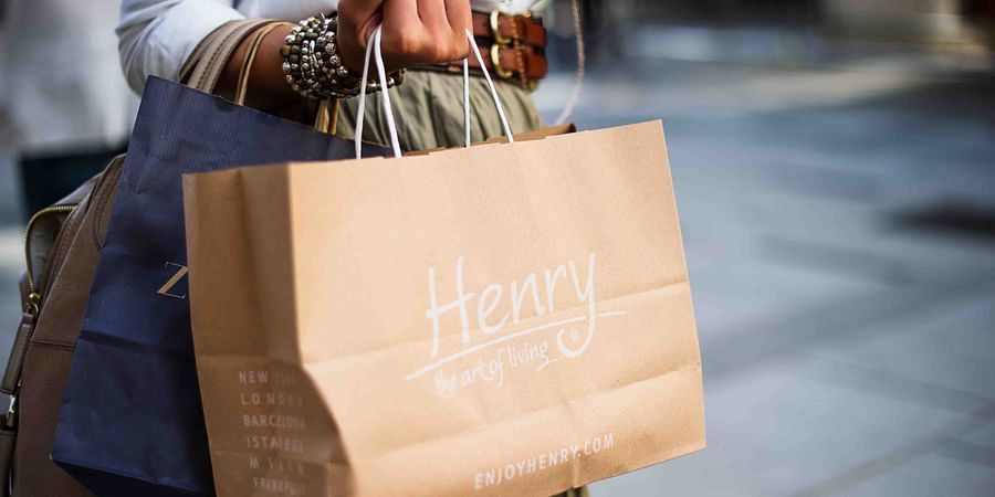a person holding shopping bags