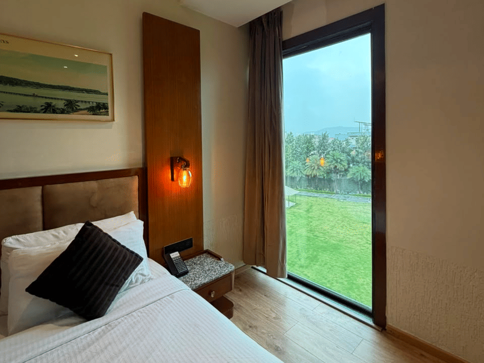 Skyline by Miraya, Family Room, Bed with garden-facing balcony