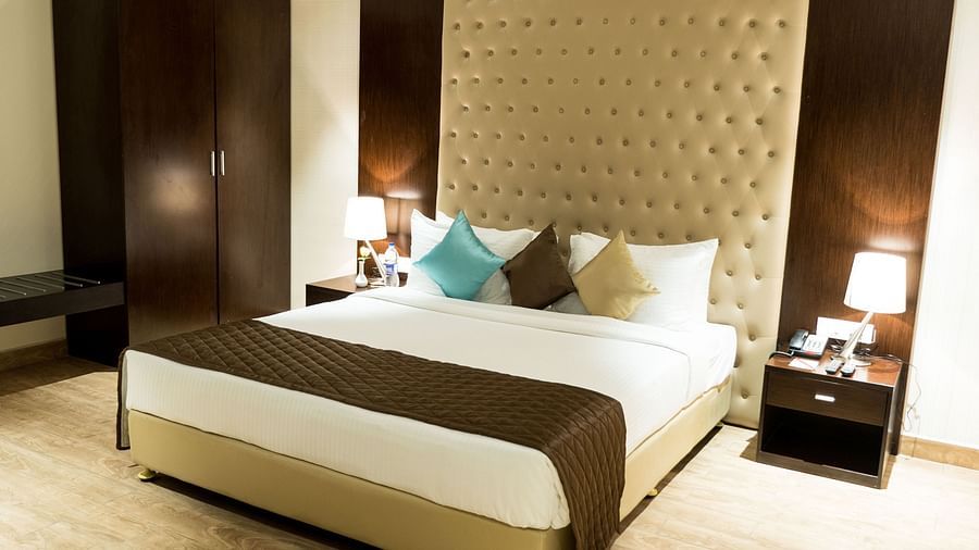A king size bed of Suite at Grand Ashok, Thanjavur.