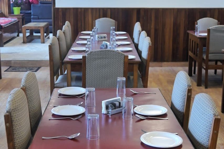 An image of the restaurant with its seating arrangement at Ecotel Chiminda, Pelling