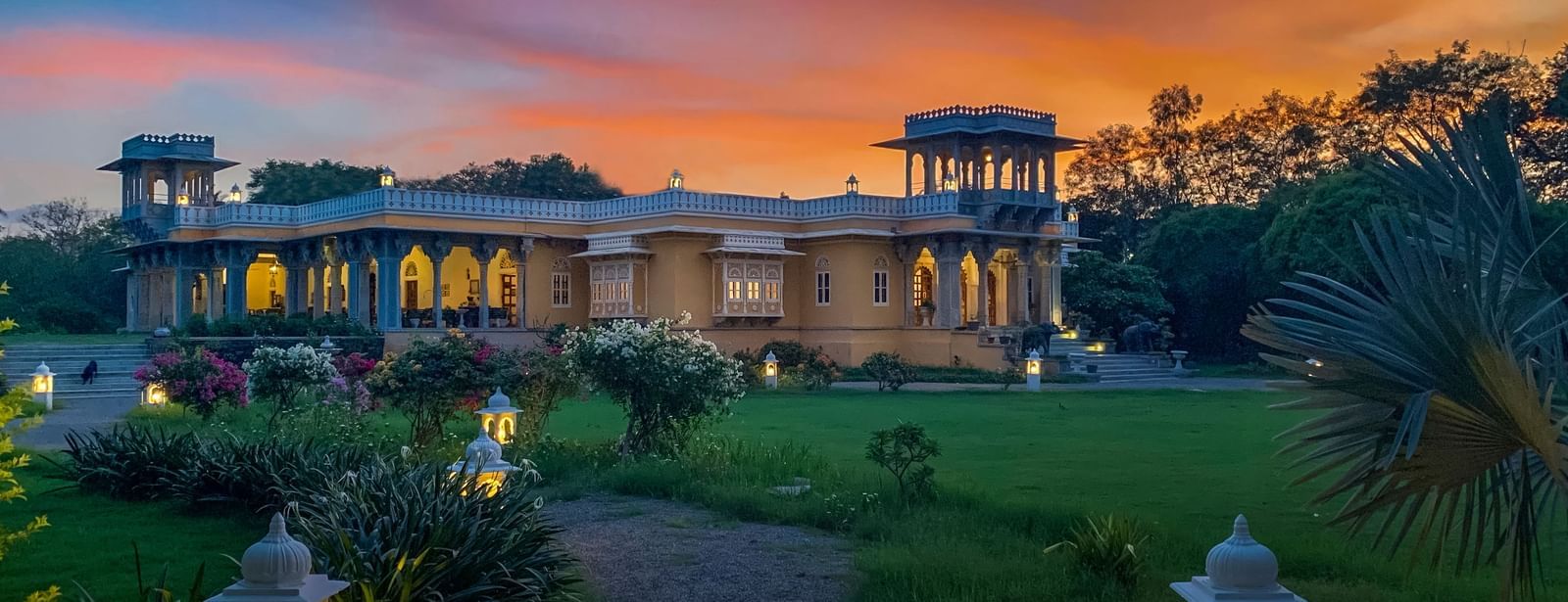 Facade image of Dev Shree, deogarh featuring a beutiful sunset in the background