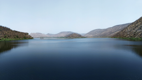The view of a lake surrounded with hills