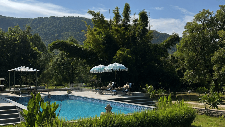 Sunny Poolside Retreat with Mountain Views-Surya Bagh