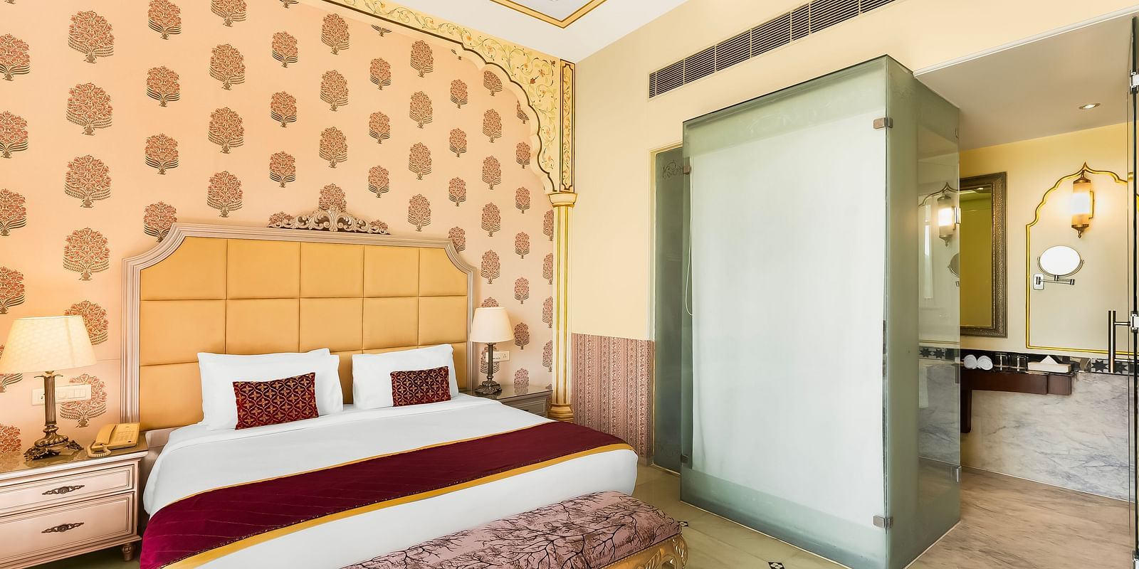 Classic heritage-style room at Rajasthali Resort Jaipur offering regal décor, soft lighting, and refined comfort.