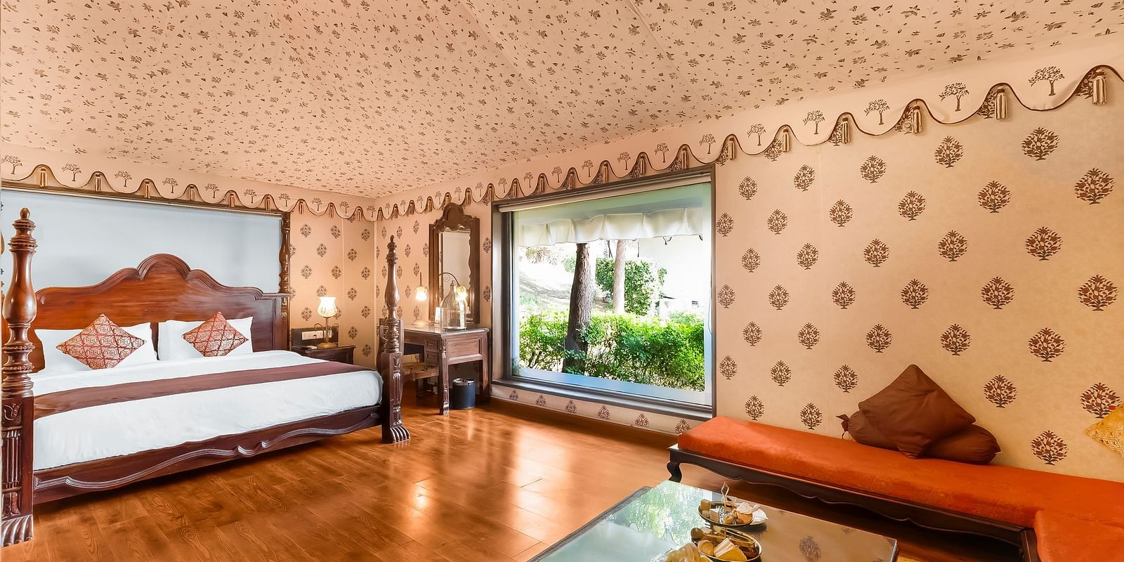 An overview of a room with a double bed, sofas and a coffee table seen - Rajasthali Resort & Spa, Jaipur.