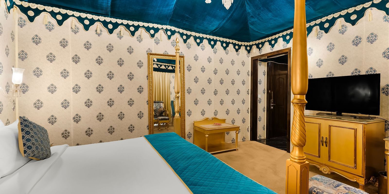 An overview of a tent with a close up shot of a double bed - Rajasthali Resort & Spa, Jaipur.