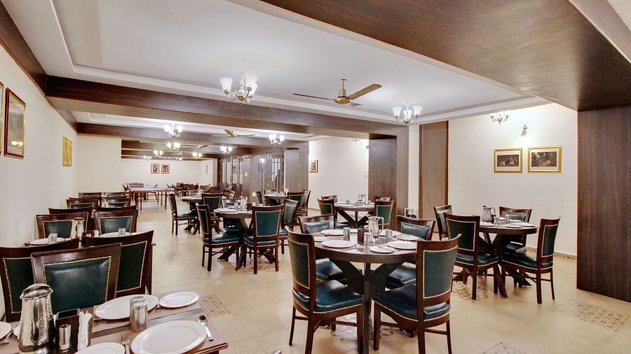Seating arragements inside the restaurant 1 at Rahi Forest View