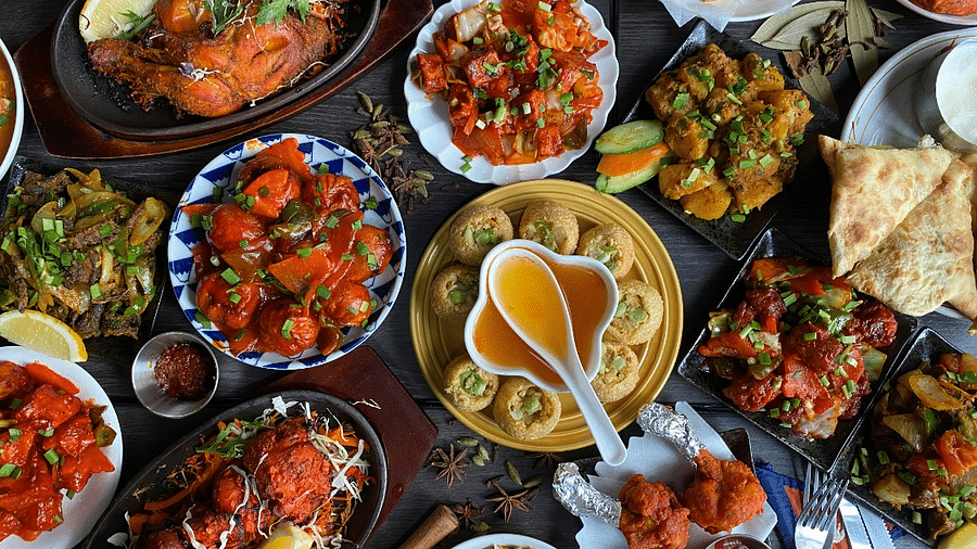 An image of several dishes from different cuisines placed in a table | Kavya Resort and Spa, Nagarkot