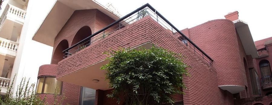 Facade of Redbrick home by earthaa escapes 2