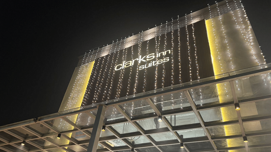 Close-up Facade view of Clarks Inn Suites, Agra against night sky.