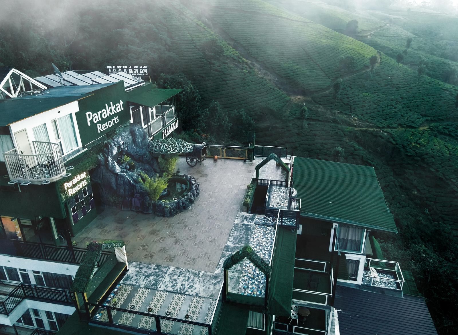 View of the Facade of Parakkat Nature Hotel and Resorts, Munnar amidst the fog 