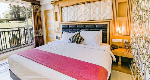 A double bed in Classic Room at Parakkat Nature Hotel and Resorts, Munnar