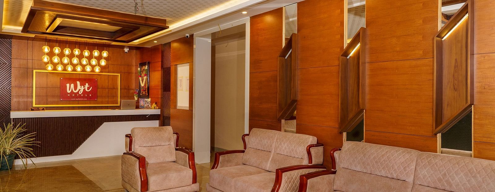 Side view of lobby with sofas at Wyt Hotels, Rameswaram 