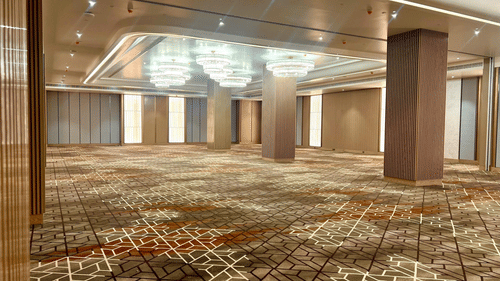 A side view of banquet hall in Hargeisa with high ceilings featuring chandeliers - Serene Sarovar Premiere Hargeisa